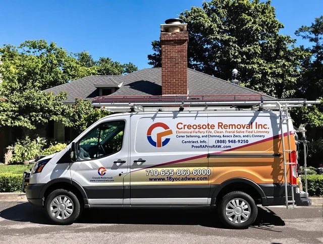 Hudson Chimney Sweep technician removing creosote safely in Hudson, MA