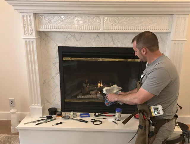 Hudson Chimney Sweep performing fireplace maintenance in Hudson, MA